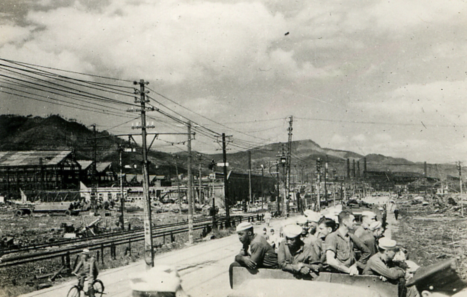 U.S. Navy Sailors Touring Bomb-Damaged Japanese Industrial Area, Postwar Occupation Era