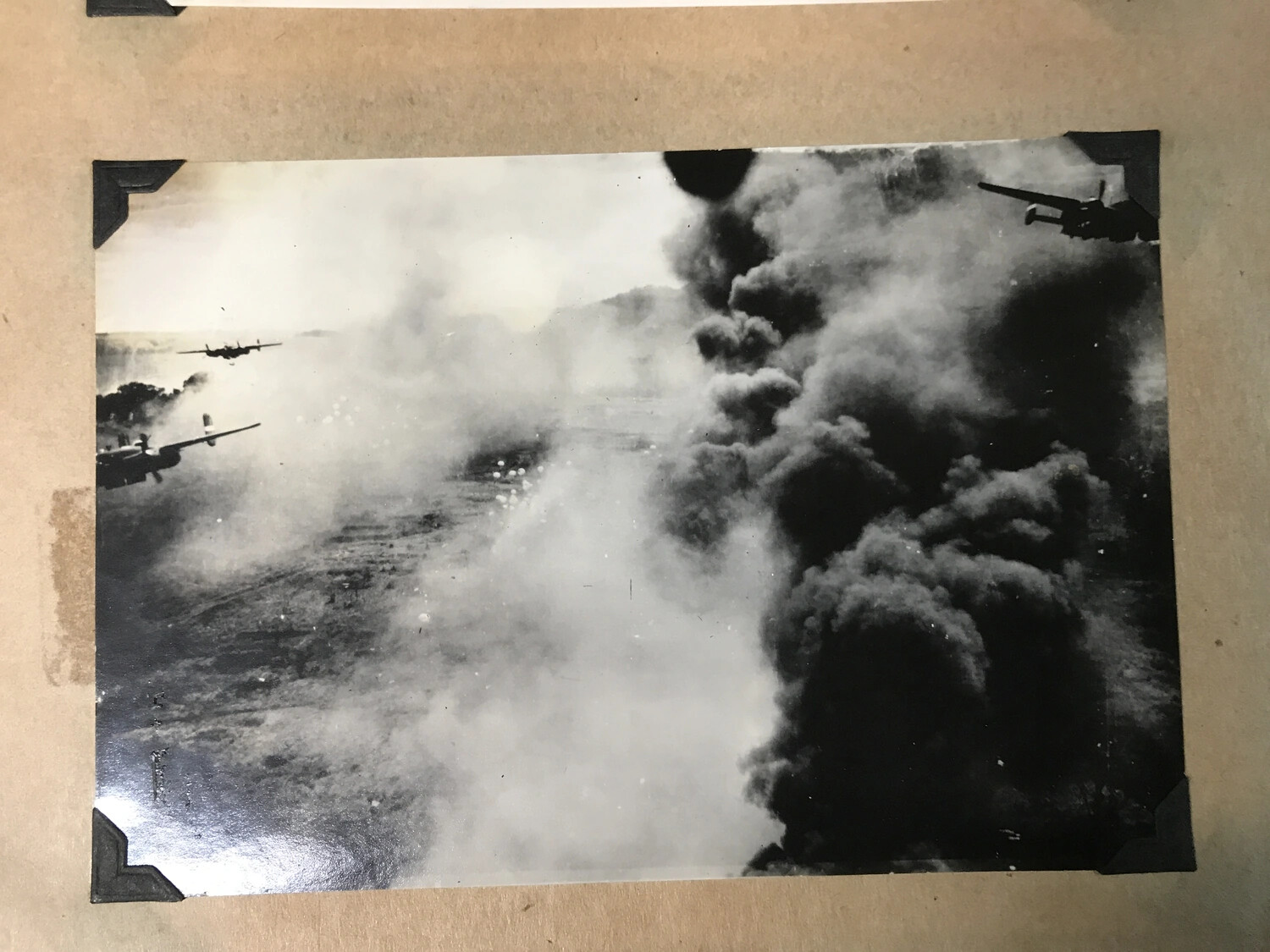 B-25 Mitchell Formation Over Coastal Target Amid Smoke Column and Falling Parafrag Bombs
