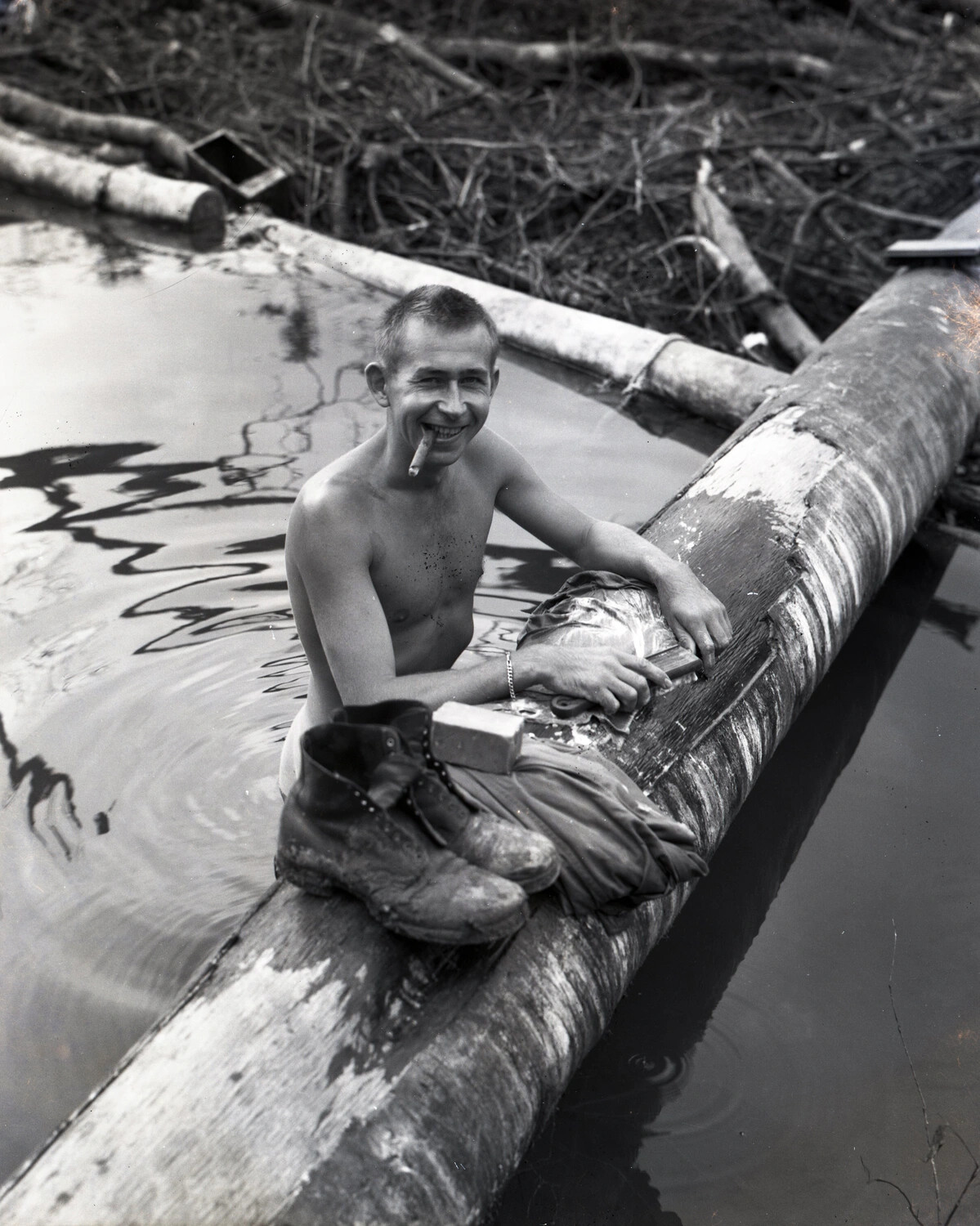 Serviceman Washing Laundry in a Jungle River, China-Burma-India Theater, WWII
