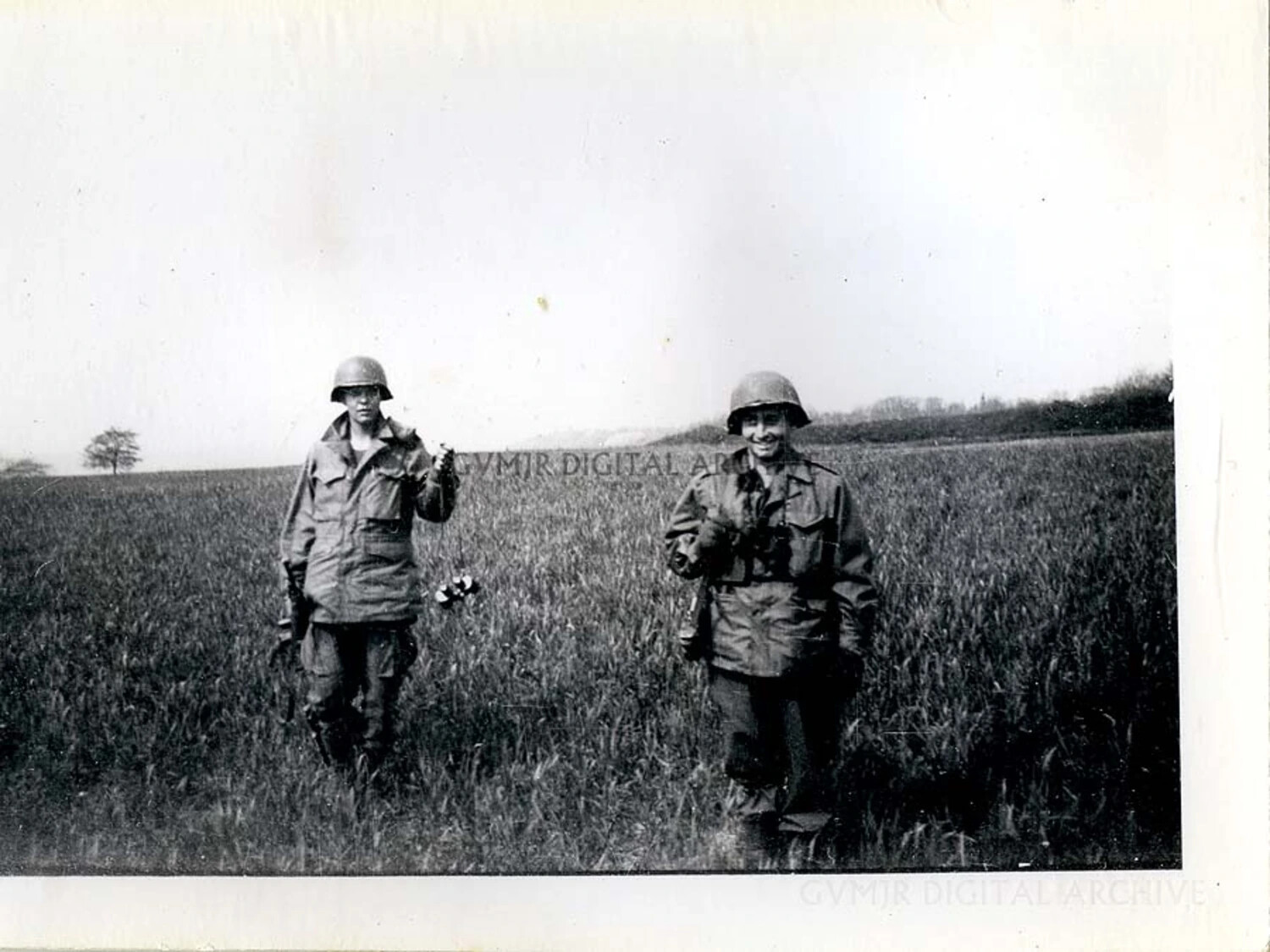 Paratroopers with Handheld Mine Detector in an Open Field, WWII European Theater
