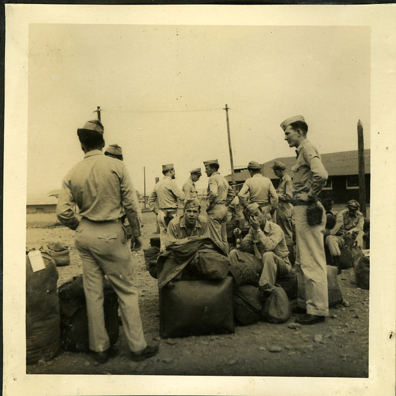 American Servicemen with Duffel Bags Awaiting Transport, Occupied Japan, Postwar