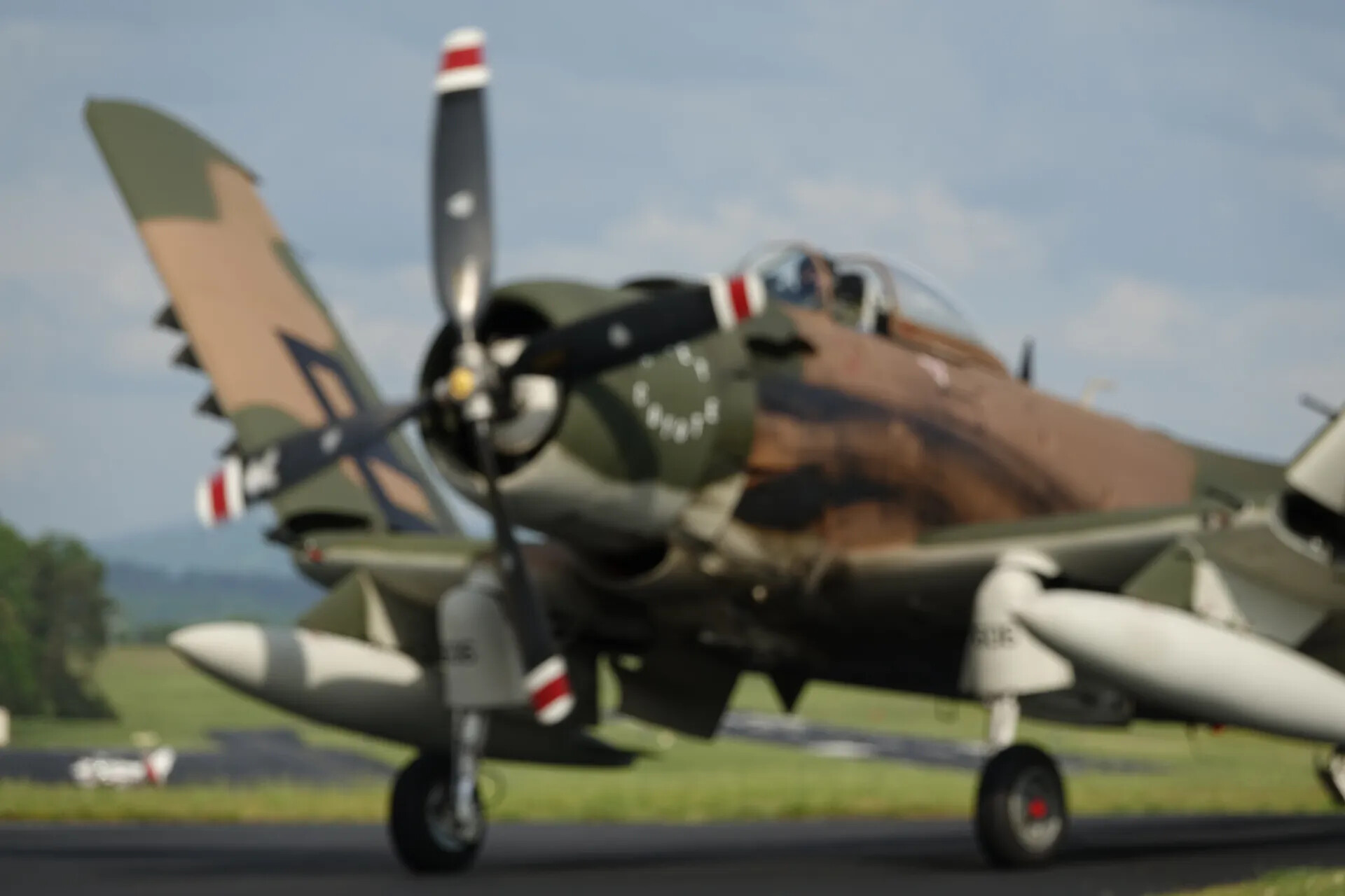 Camouflaged Radial-Engine Warbird Taxiing on Ramp, May 2019 Airshow Event (Motion-Blurred)