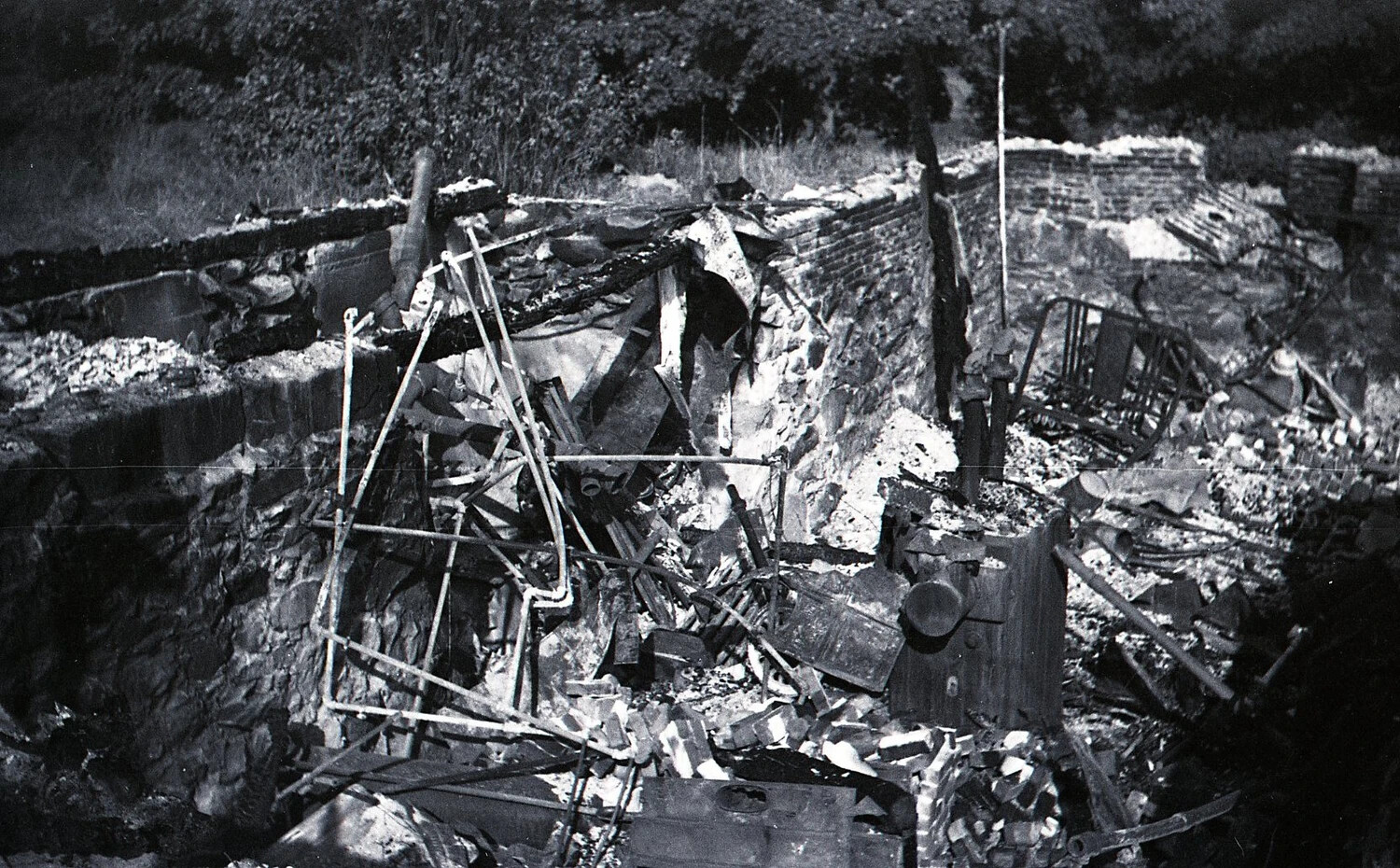 Fire-Damaged Dairy Barn Ruins, Detail of Collapsed Roofing and Foundation Wall