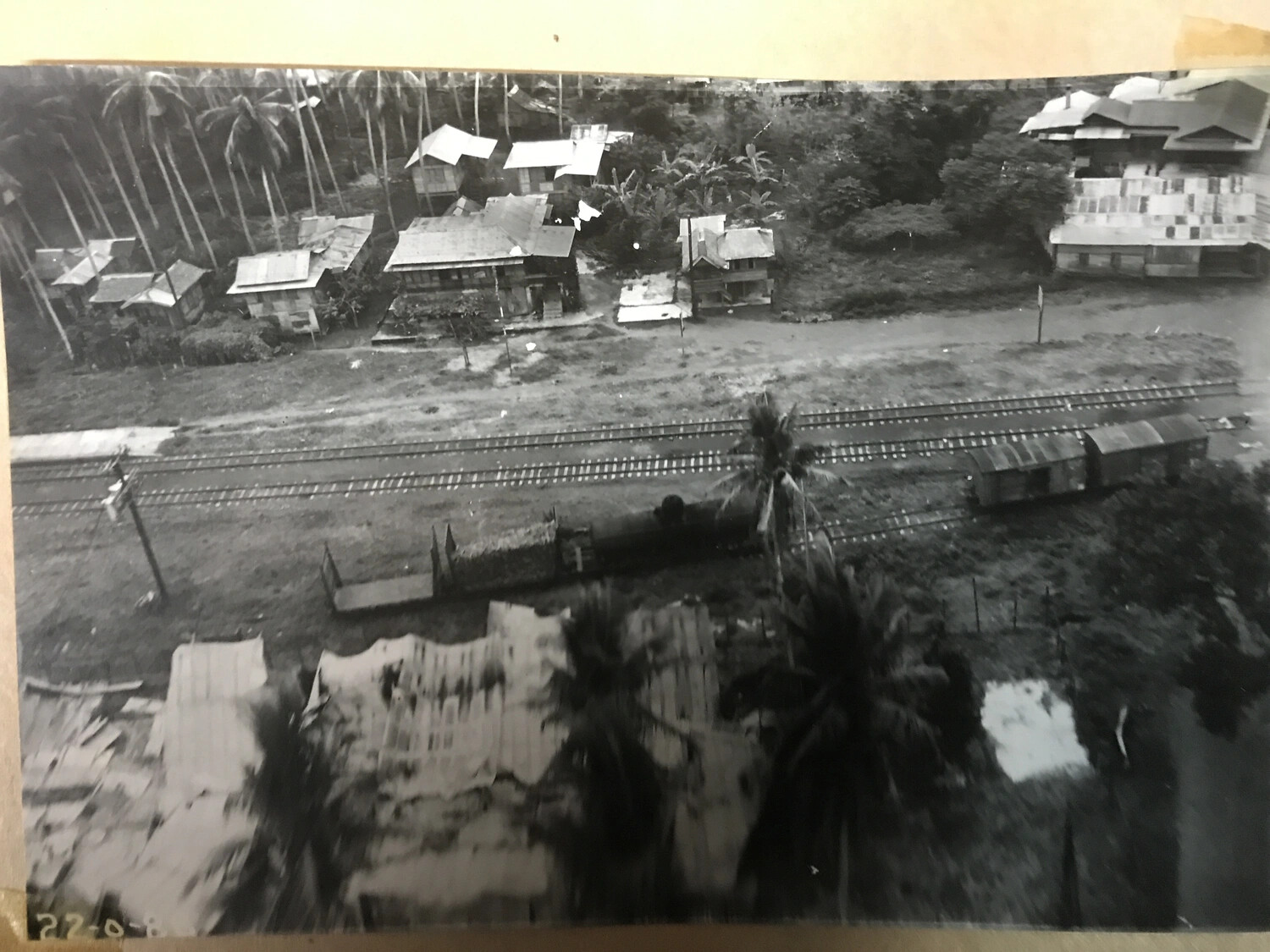 Low-Altitude Aerial Pass Over Philippine Rail Corridor and Village Rooftops (Full Print)