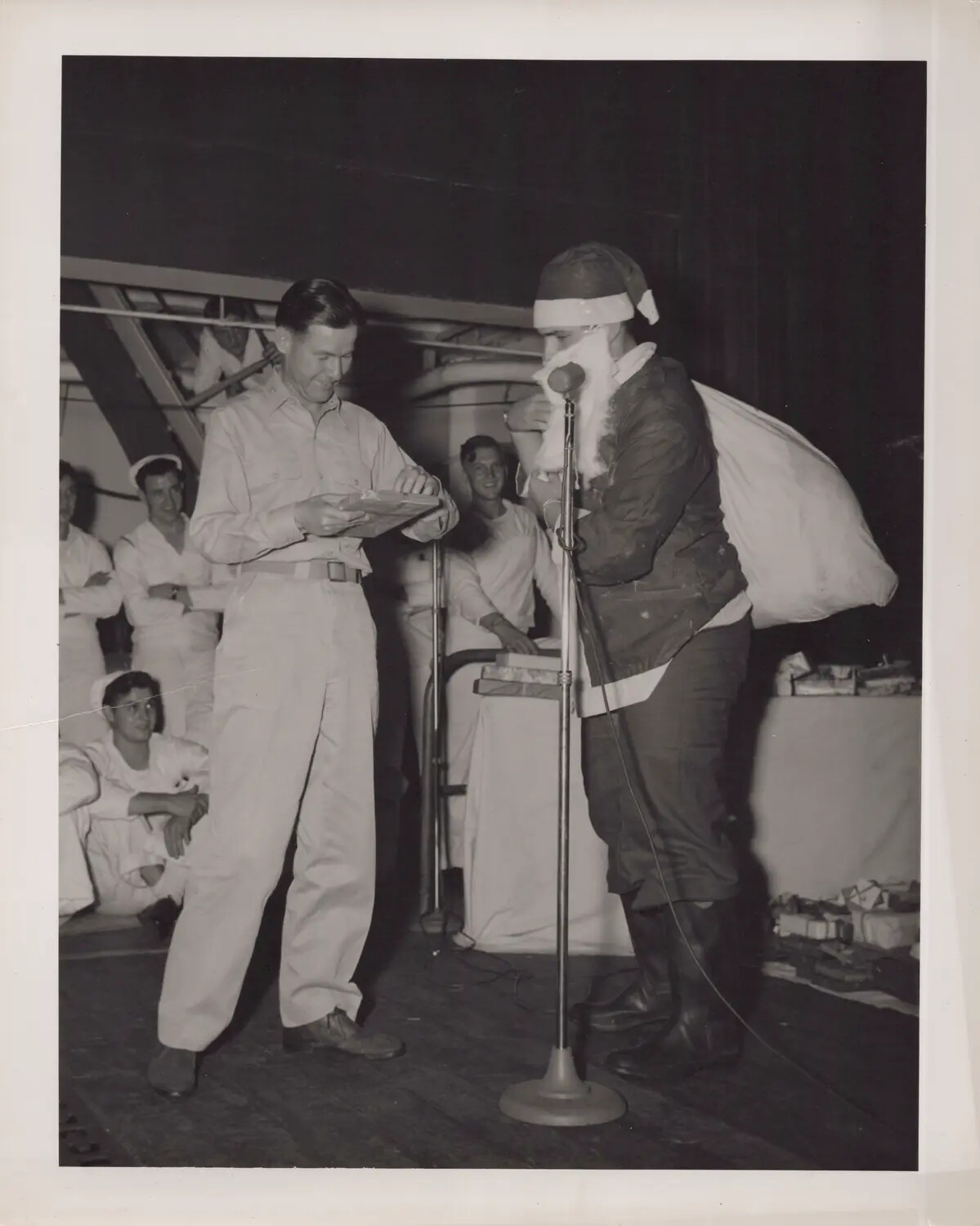 Shipboard Christmas Celebration with Sailor Dressed as Santa Claus, WWII