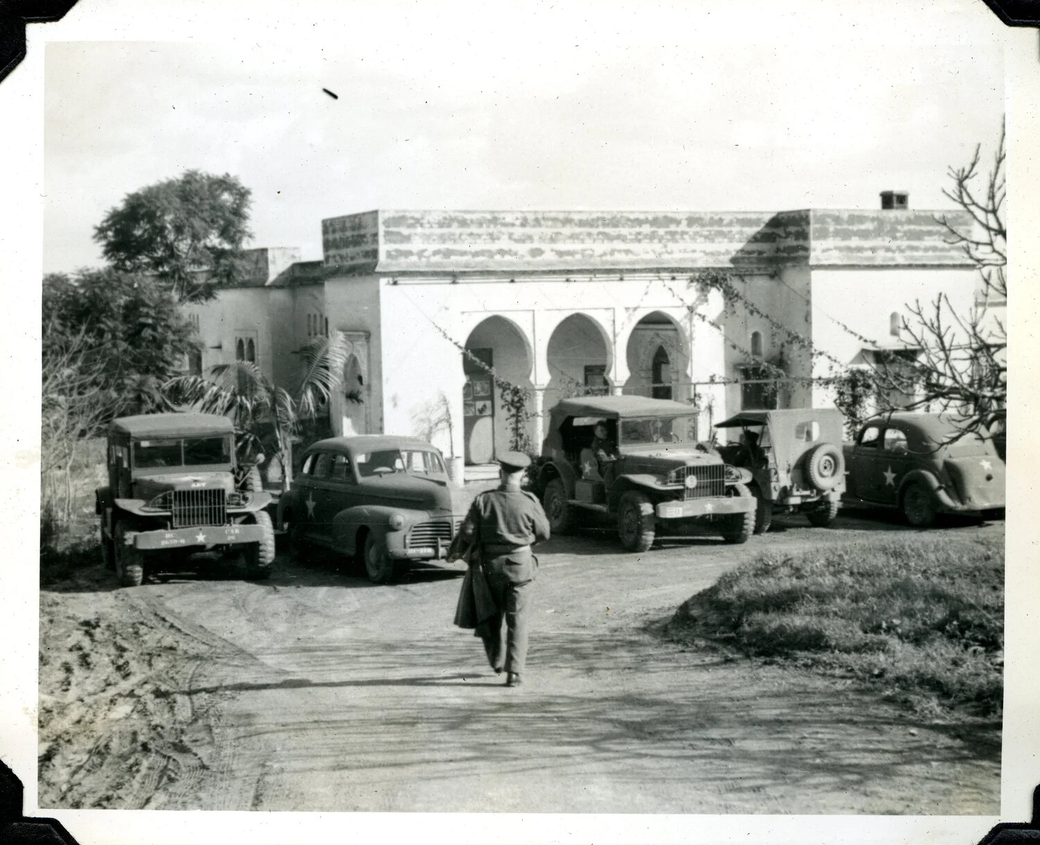U.S. Army Vehicles Parked at Moorish-Style Building, North Africa, World War II