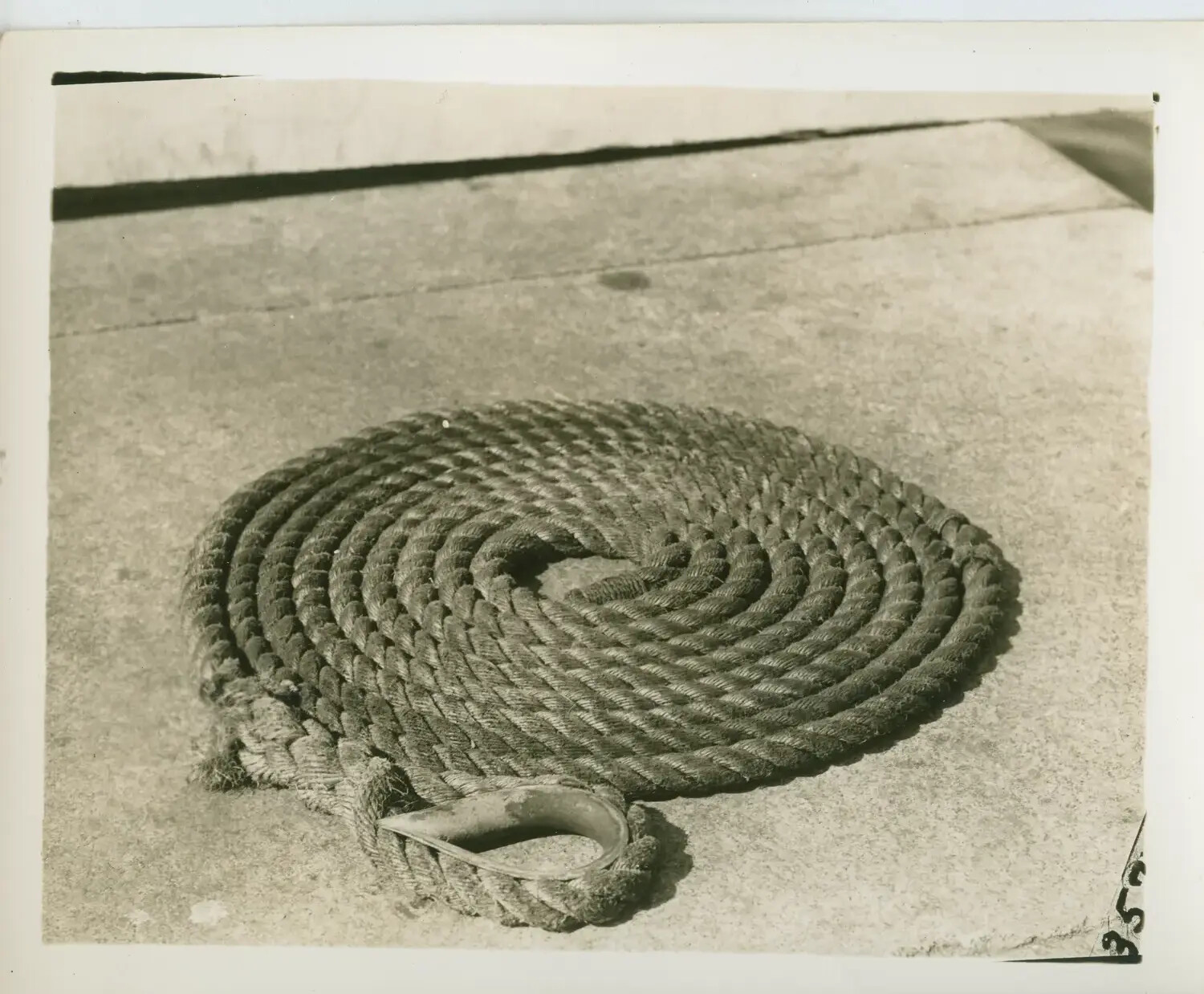 Flemished Line with Spliced Eye and Thimble on Deck, USS Petrof Bay (CVE-80)