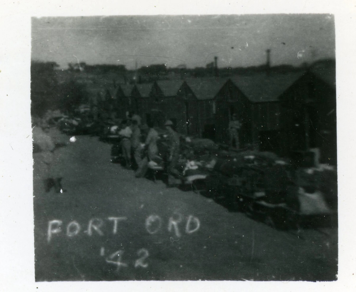 Soldiers with Stacked Gear Along Company Street, Fort Ord, California, 1942