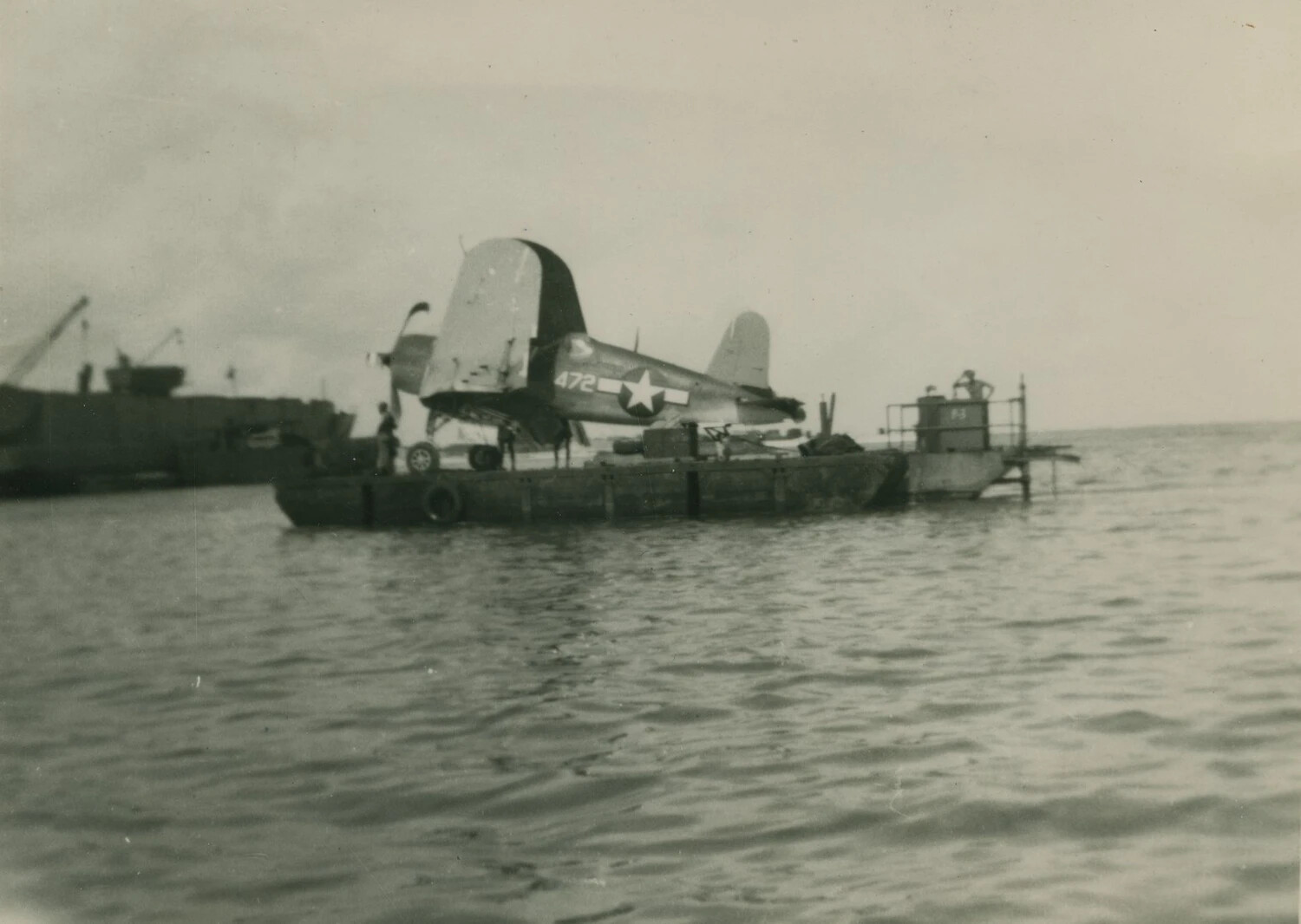 F4U Corsair Fighter on Floating Salvage Barge, Pacific Theater