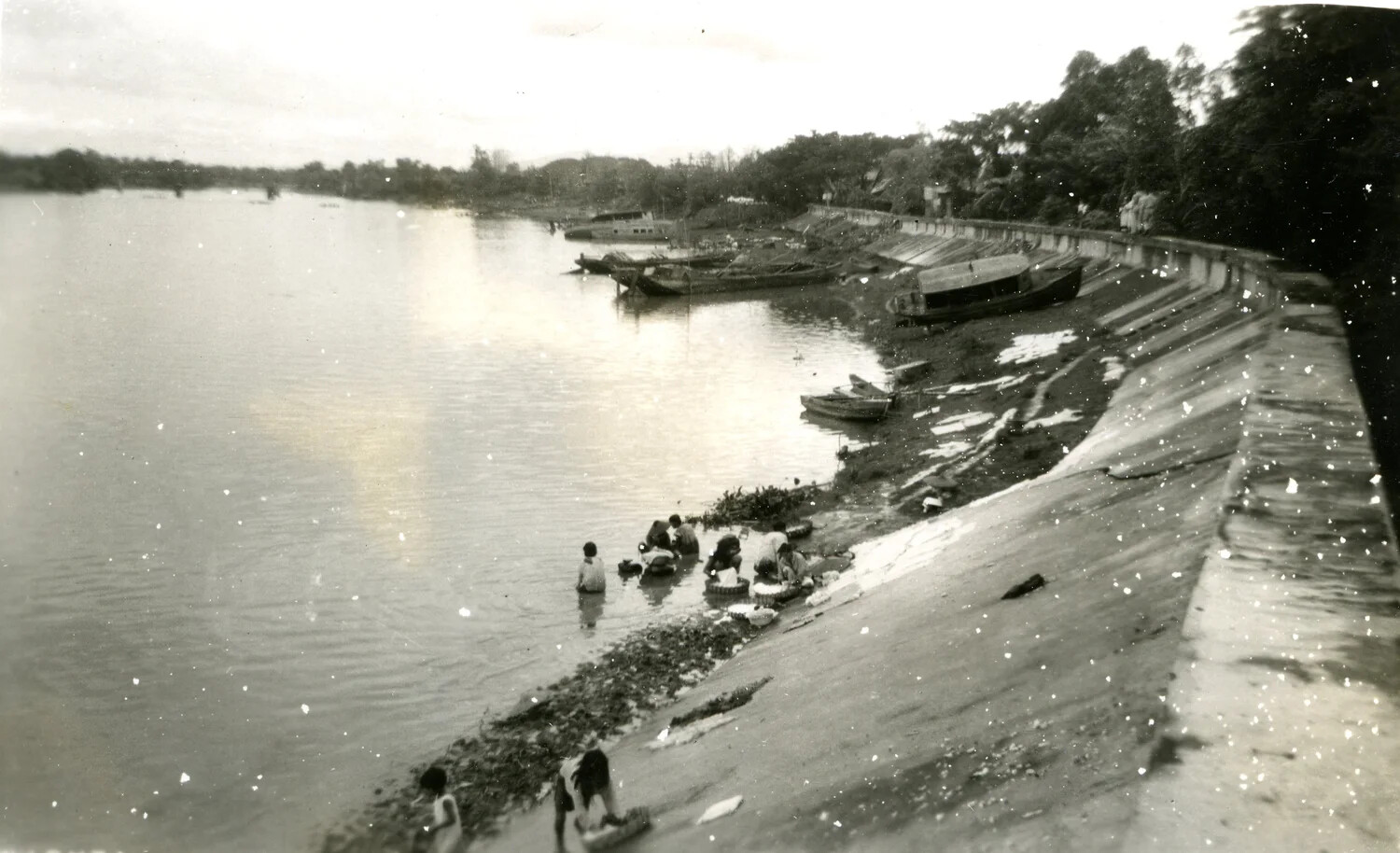 Riverside Scene with Moored Boats and Local Residents Washing Clothes, Philippines, WWII Photo Album