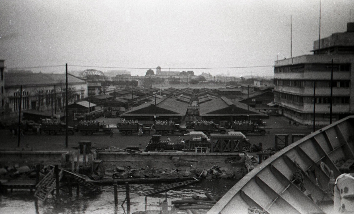 U.S. Army Truck Convoy Transporting Troops Through Manila Port Area, Philippines, 1945