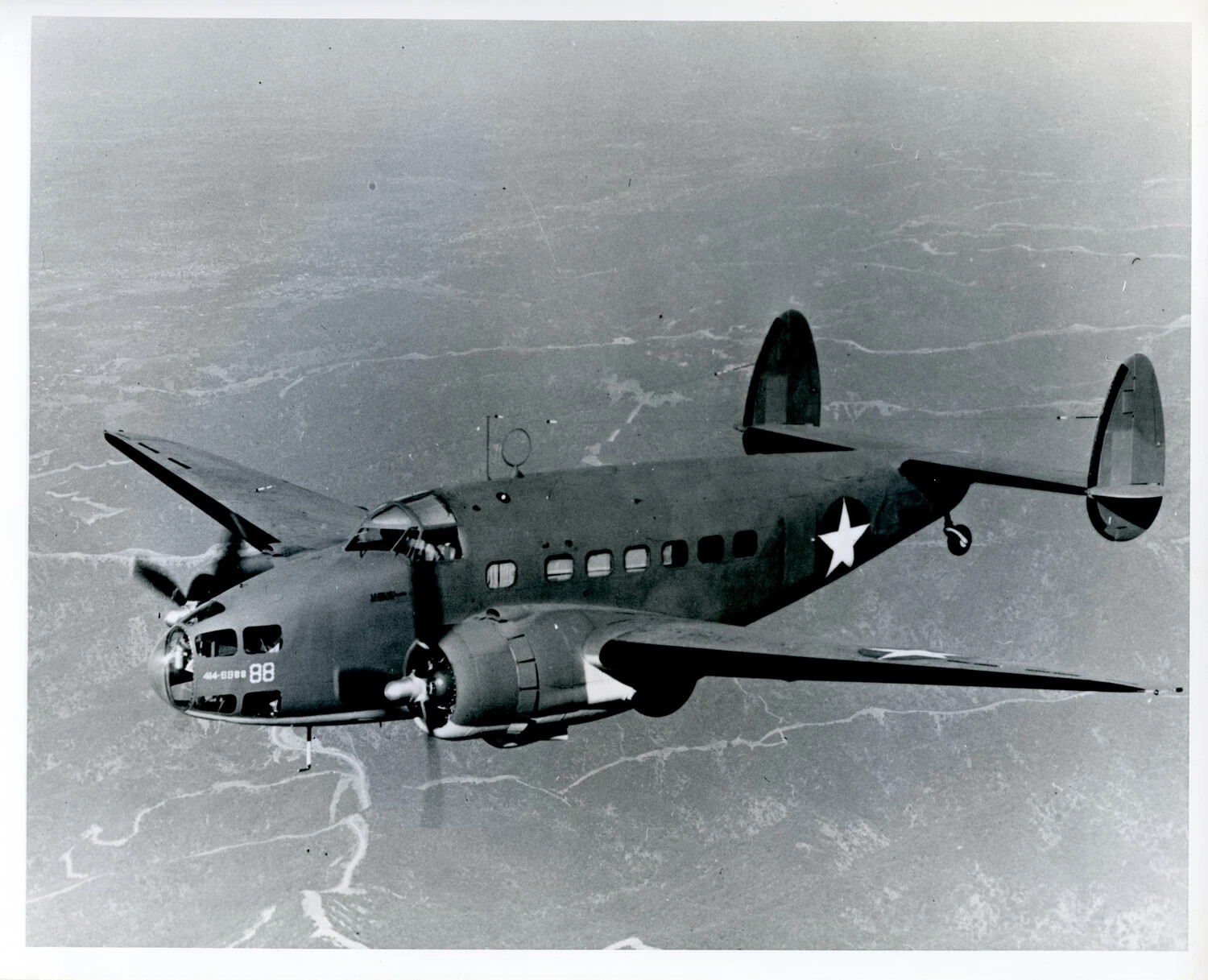 Lockheed Lodestar (C-60) Twin-Engine Military Transport Aircraft in Flight, WWII Era