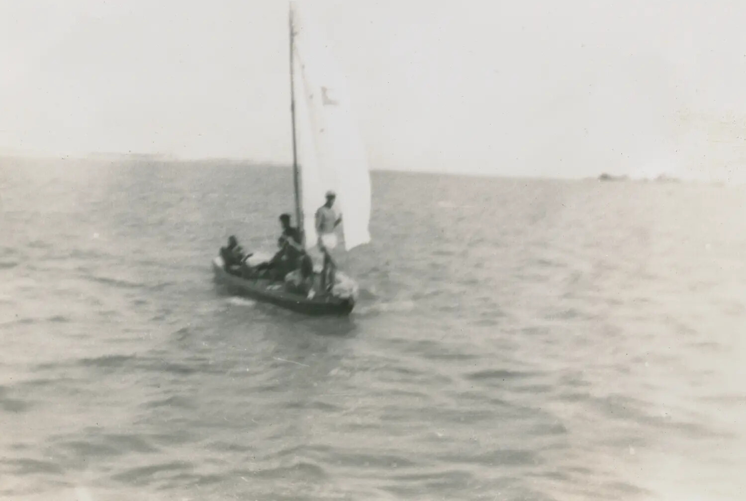 Servicemen Sailing a Rigged Ship's Boat, Edward P. McAleer Photo Album, WWII