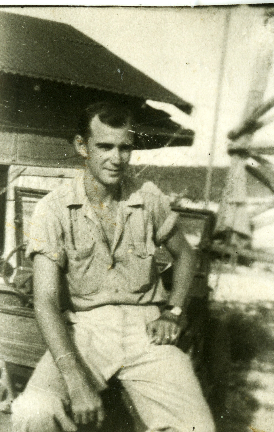 Portrait of US Serviceman Seated on Vehicle, Okinawa, WWII Era