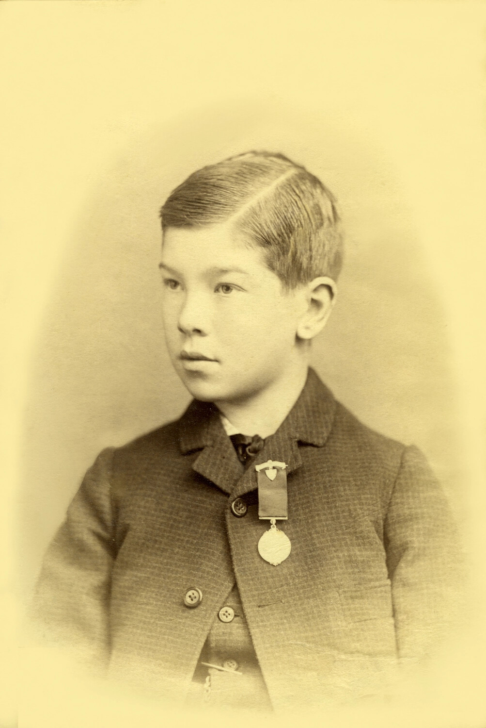 Studio Portrait of a Boy, Age 12, with Medal (Carl Stone Collection)