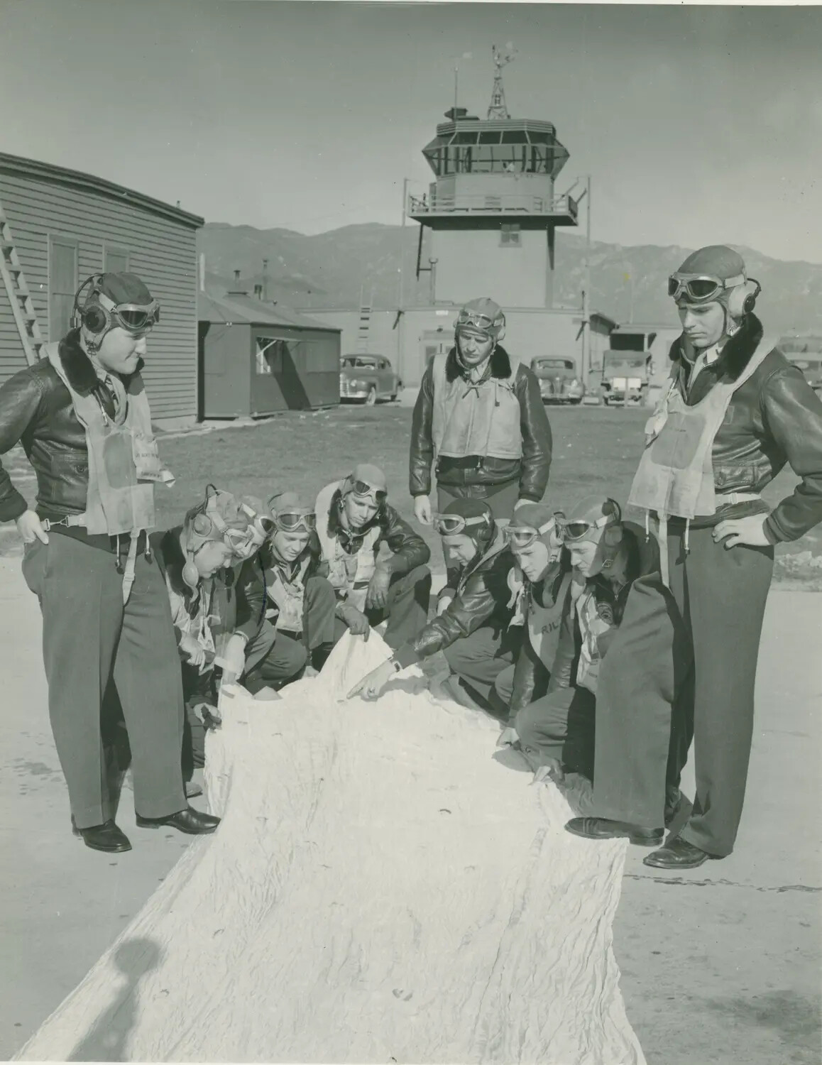 Naval Aviators Inspecting a Parachute on the Flight Line - Pat McAleer Collection