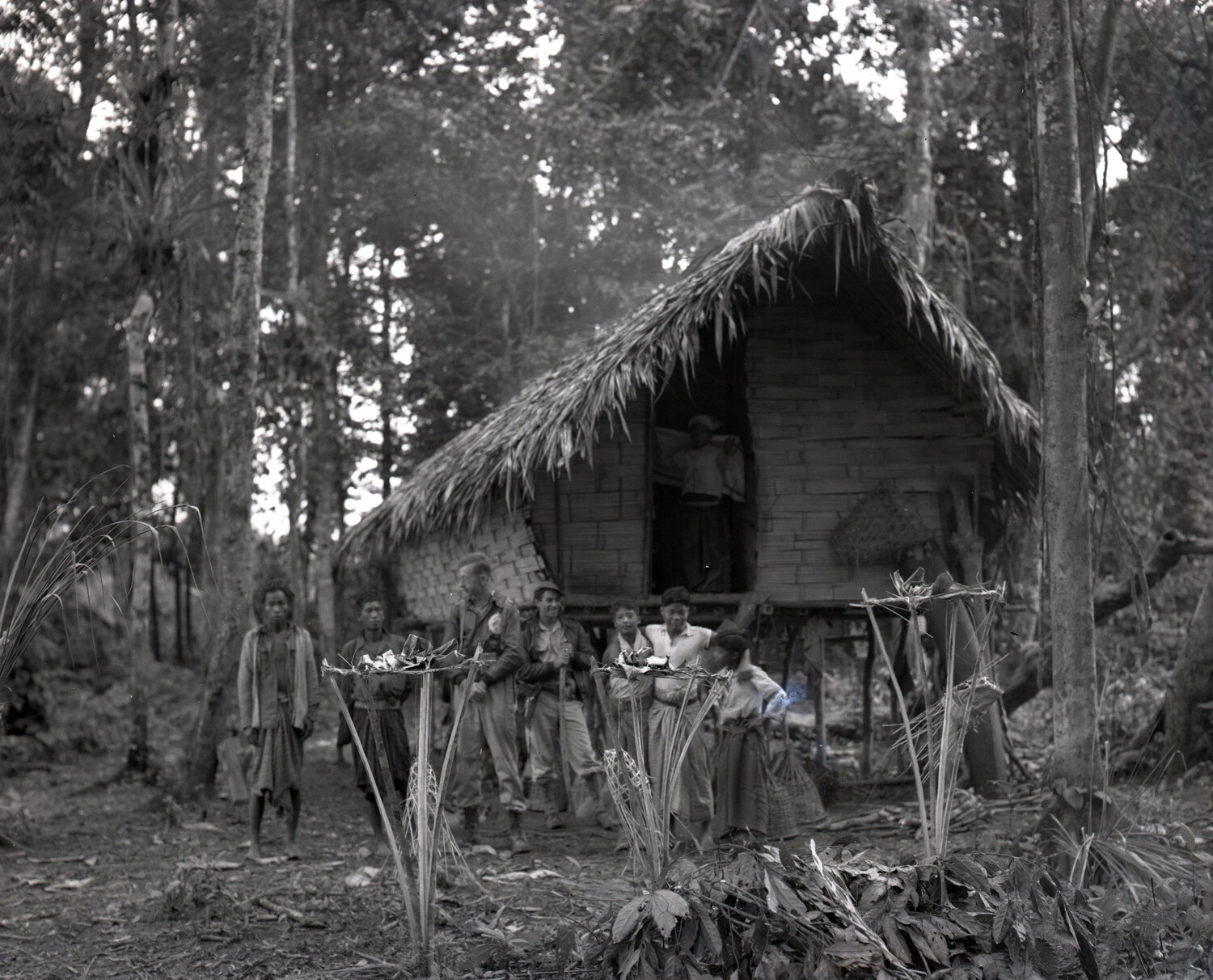 American Personnel and Local Villagers at a Stilt Longhouse, Upland Burma, WWII China-Burma-India Theater