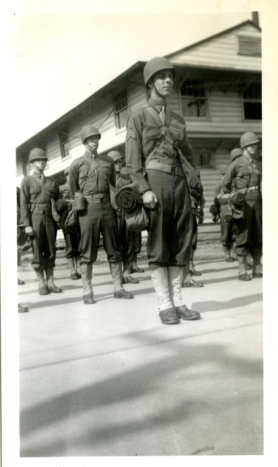 U.S. Army Soldiers in Formation with Bedrolls and Field Gear, WWII Training/Staging Camp