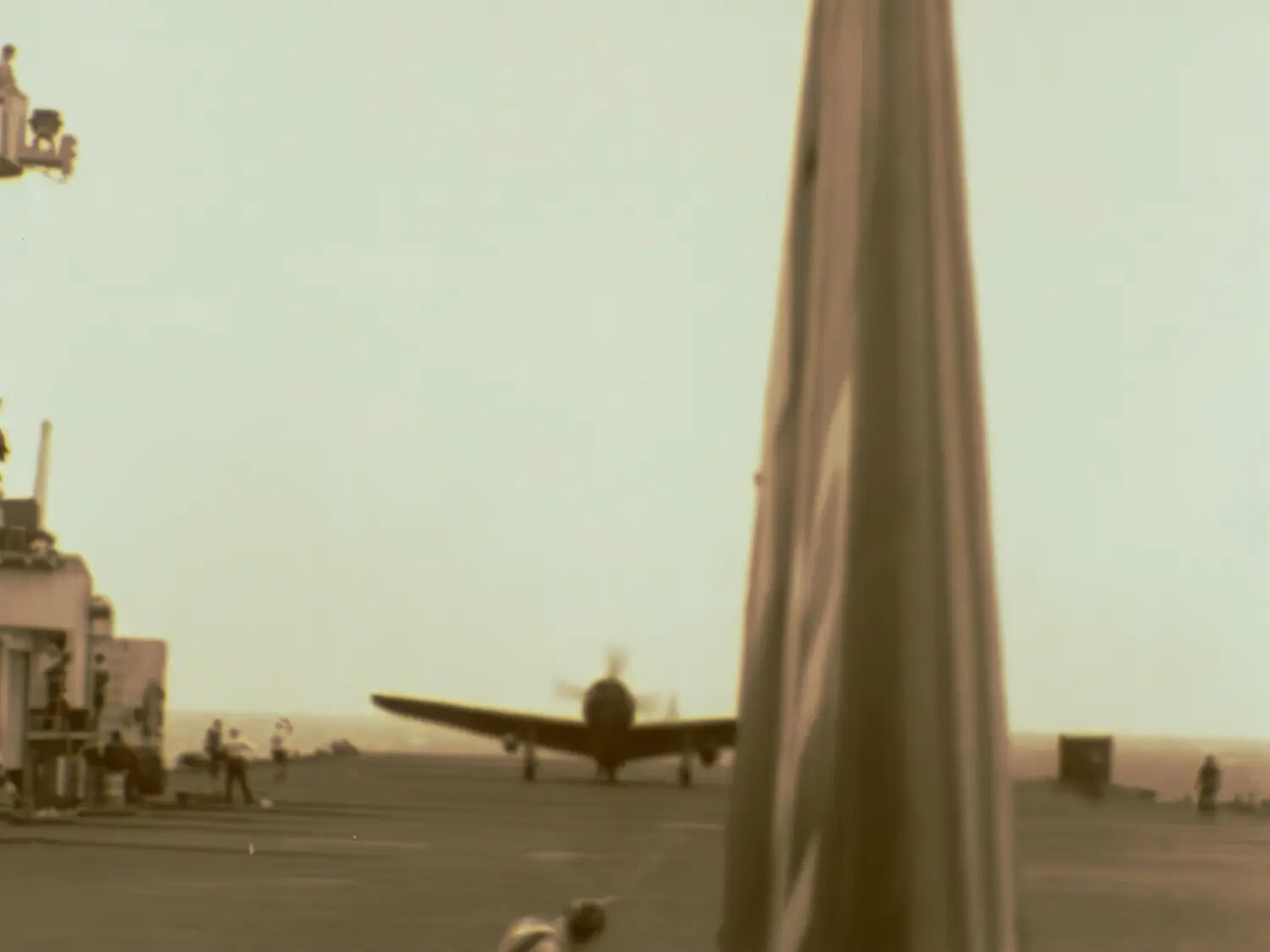 Aircraft Carrier Flight Deck with Fighter Preparing for Launch, WWII Pacific Theater (Film Still)