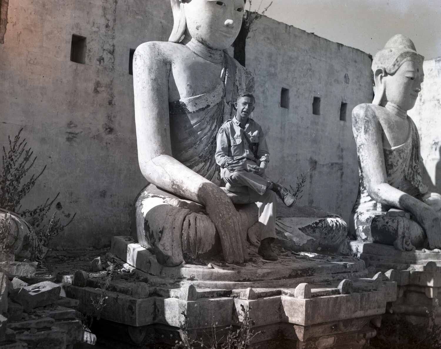 American Serviceman Seated on Ancient Buddha Statue, Katha, Burma, WWII CBI Theater