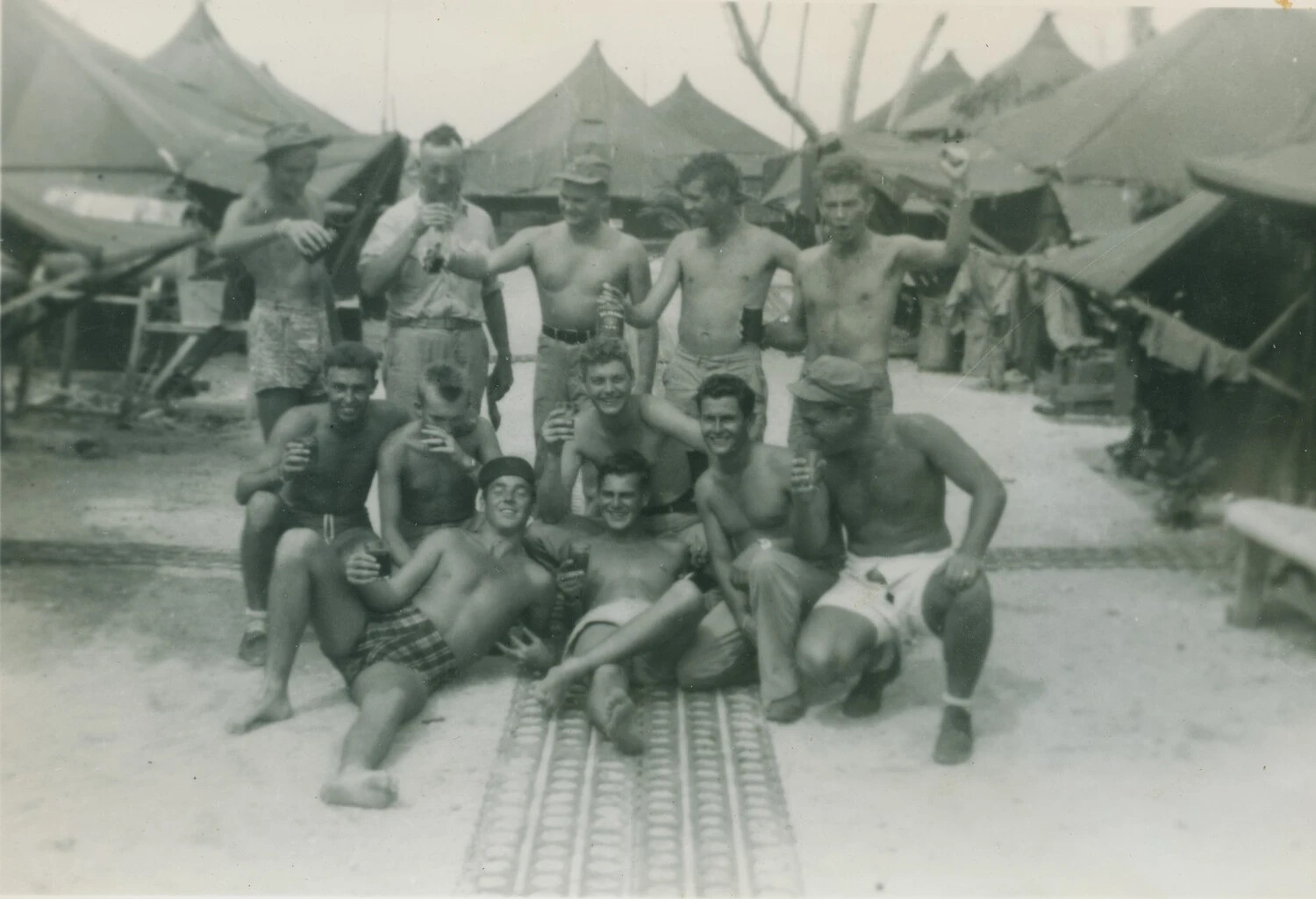Group Portrait of Servicemen at Pacific Theater Airbase Tent Camp, WWII