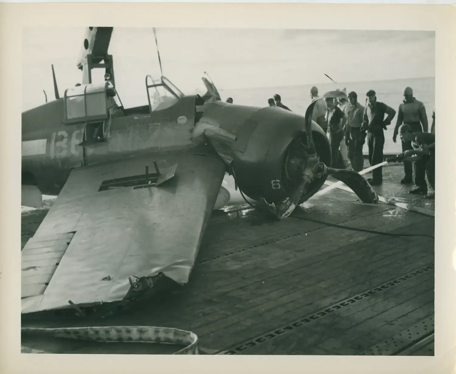 Crash-Damaged Carrier Aircraft on the Flight Deck of USS Petrof Bay (CVE-80)