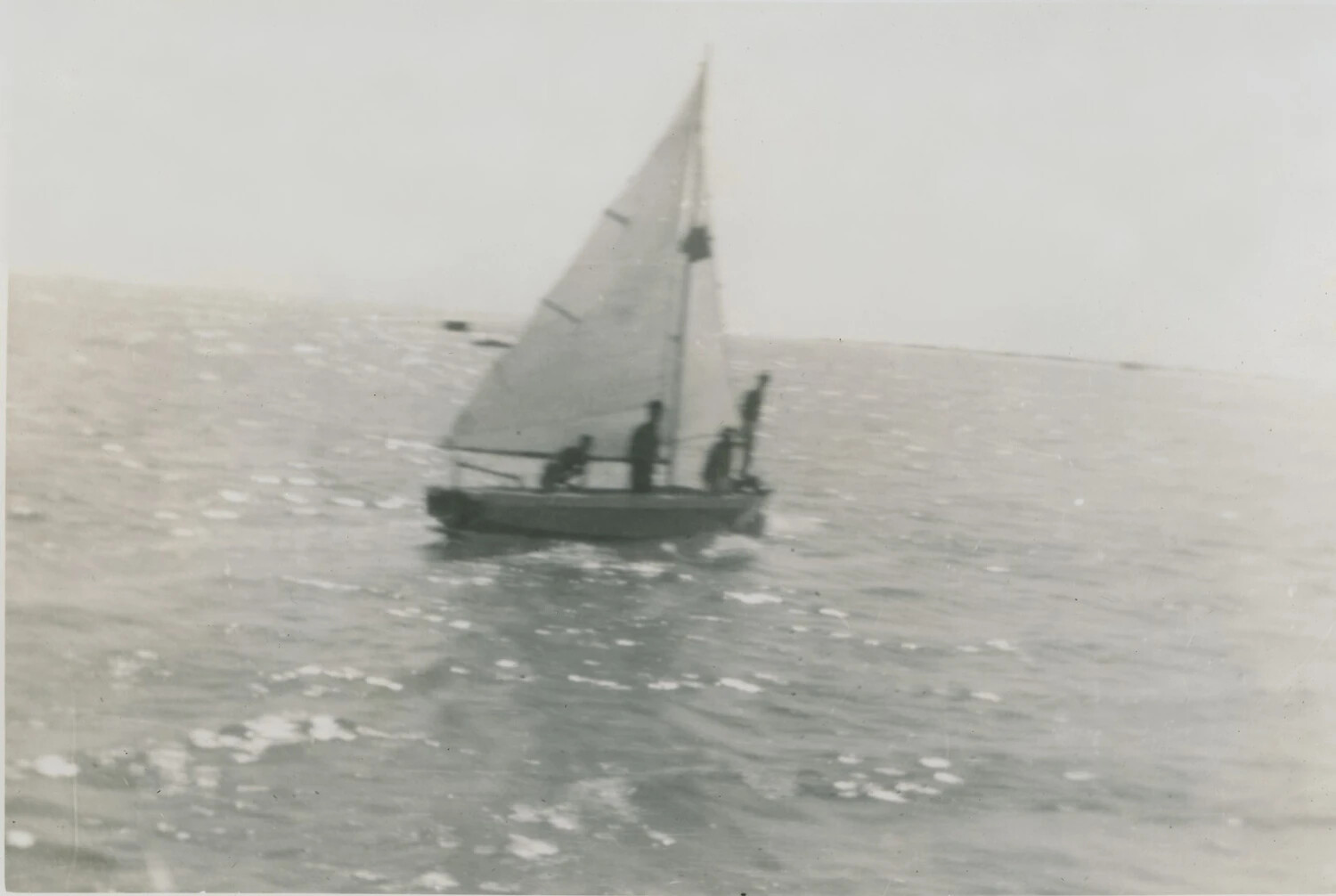 Small Sailboat with Three Men on Open Water, Pat McAleer Personal Album