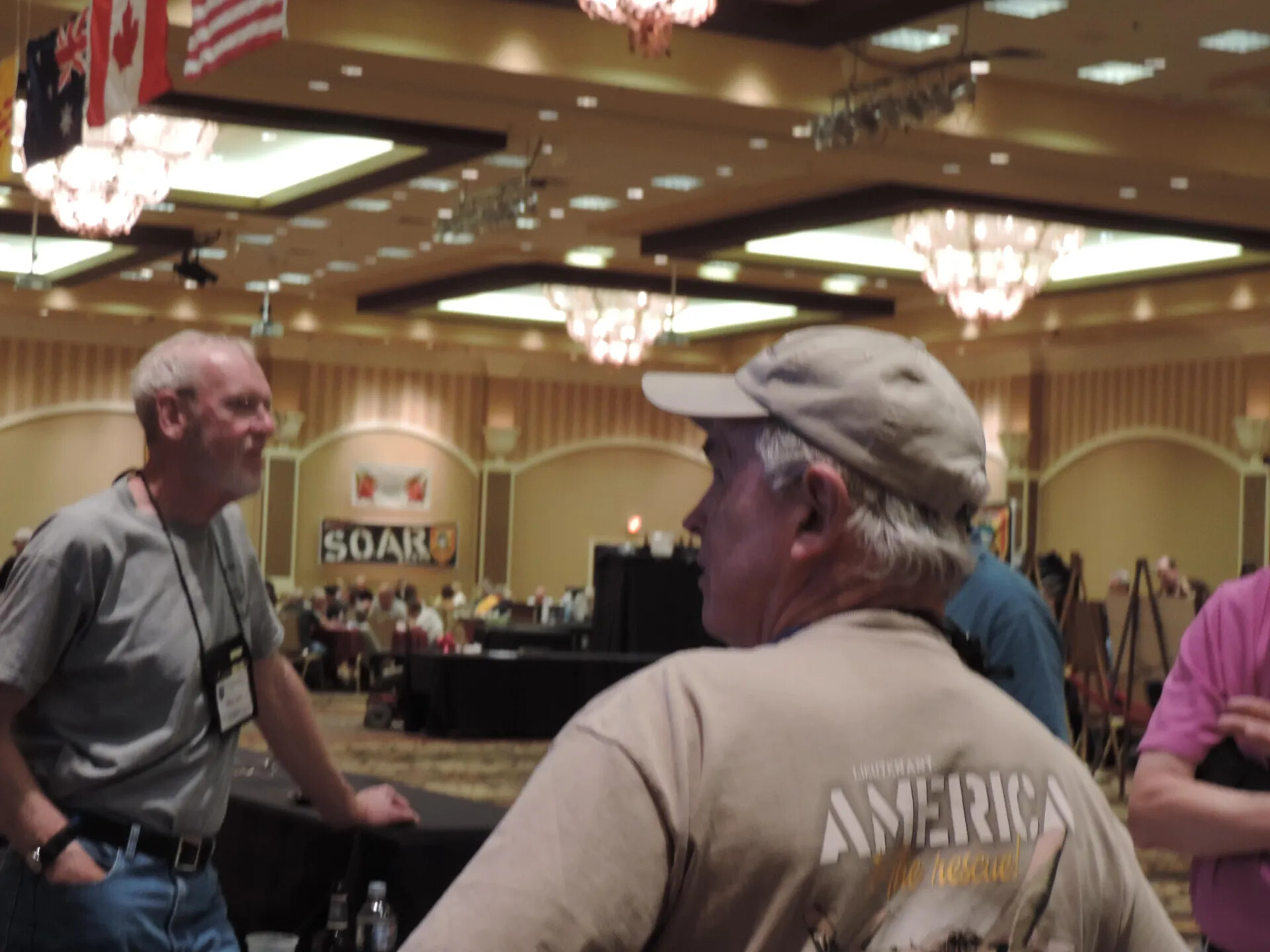 Candid of Two Attendees Amid the Crowd, SOAR XXXVII, Las Vegas, 2013 (soft focus)
