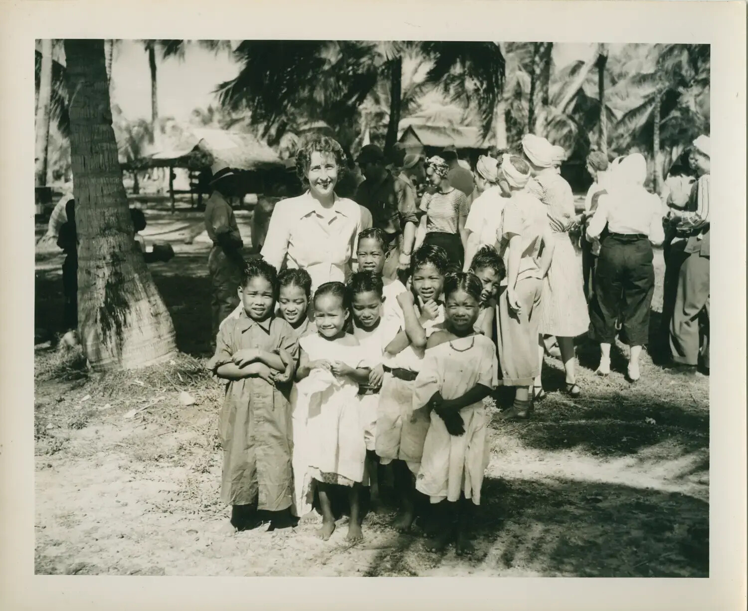 Petrof Bay (CVE-80) Personnel with Local Village Children, Pacific Theater, WWII