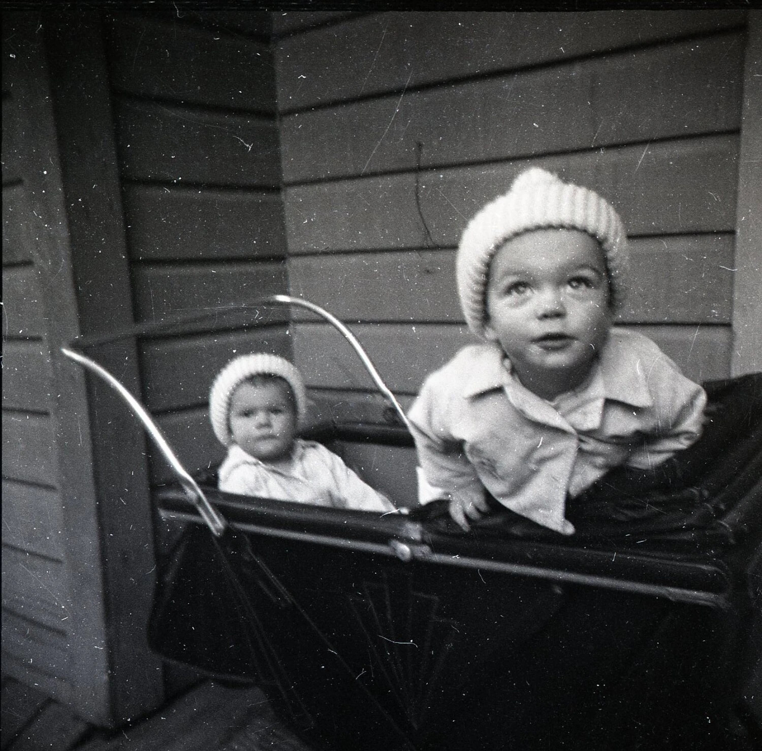 Two Children in Baby Carriage on Porch, Kelley Family Album