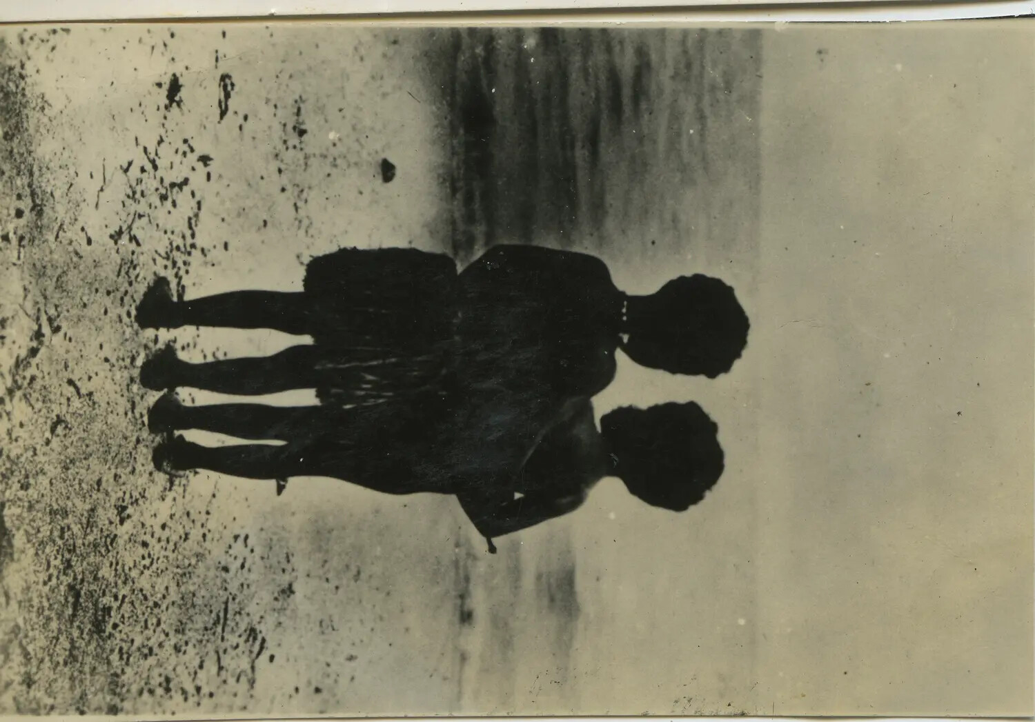 Overexposed Snapshot of Two Silhouetted Figures, Orientation and Subject Unconfirmed (312th Bomb Group Collection)