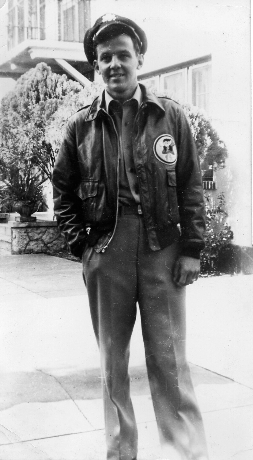 Portrait of Airman in A-2 Flight Jacket with Squadron Insignia Patch