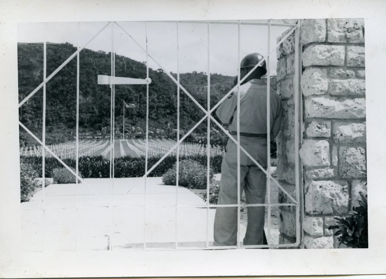 Serviceman at Military Cemetery Gate, Agana, Guam — VR-6 Squadron Album