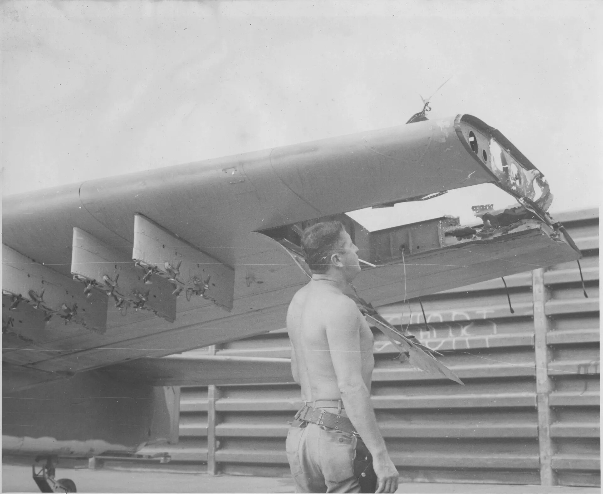 Airman Inspects Battle-Damaged Aircraft Wingtip — Jax Roberts Collection