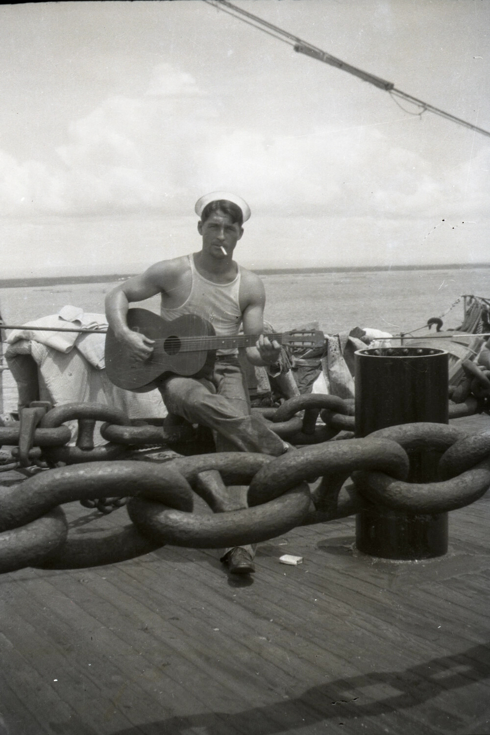 U.S. Navy Sailor Playing Guitar Among Anchor Chain, China Station, 1930s