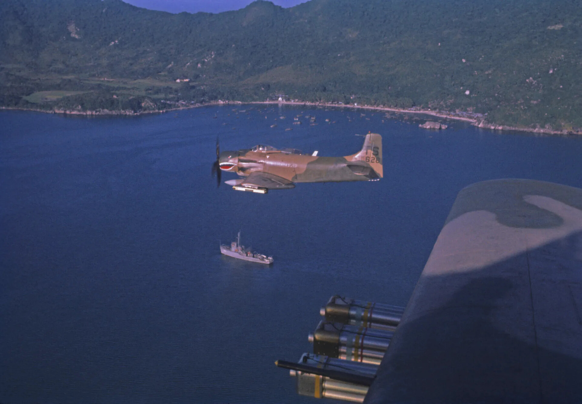 A-1 Skyraider Over Coastal Bay and Fishing Village, Vietnam