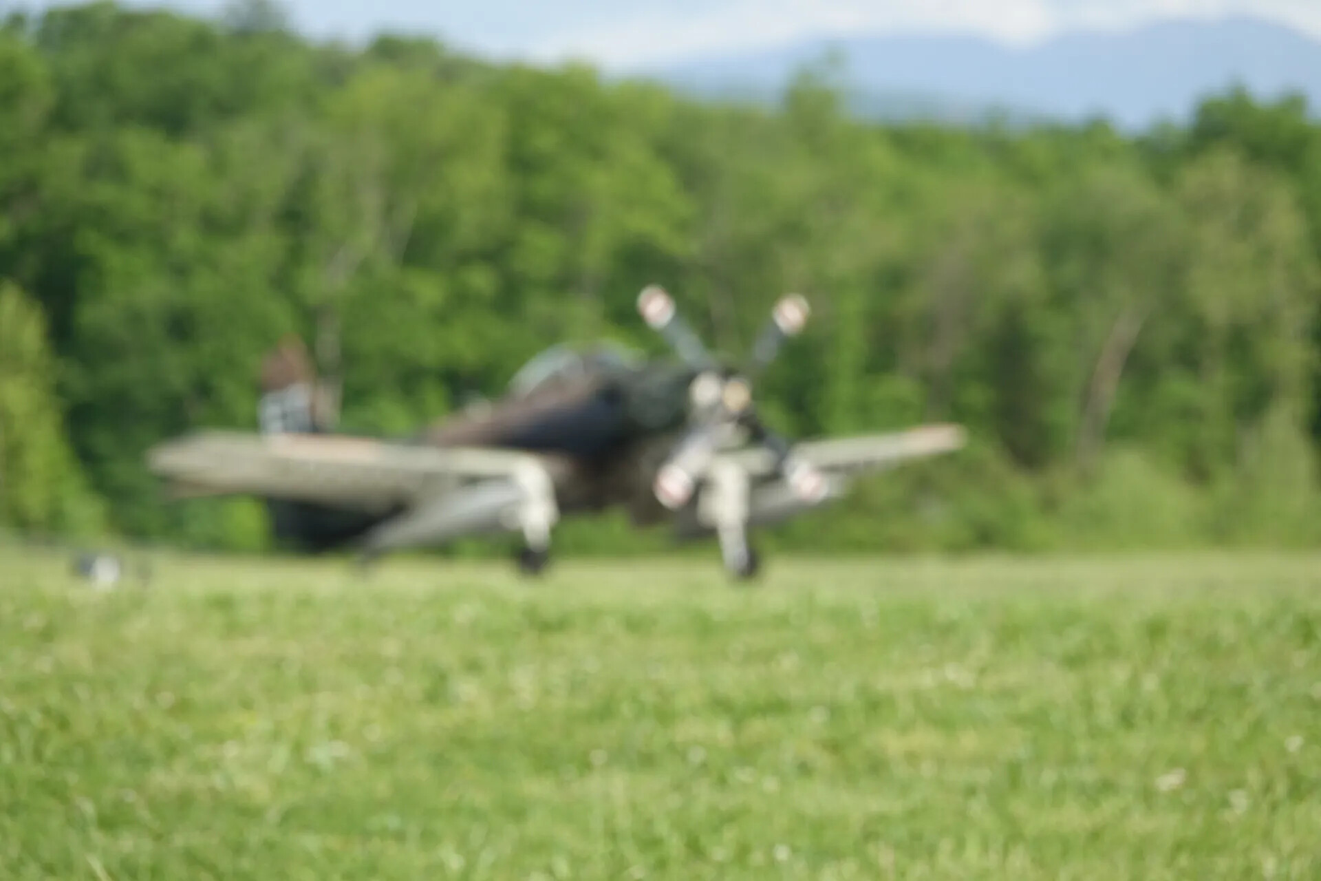 A-1 Skyraider Rolling on Grass Airfield, Out-of-Focus Action Shot