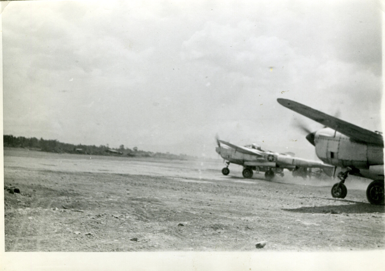 Lockheed P-38 Lightning Fighters Taxiing on Forward Airstrip, March 1945