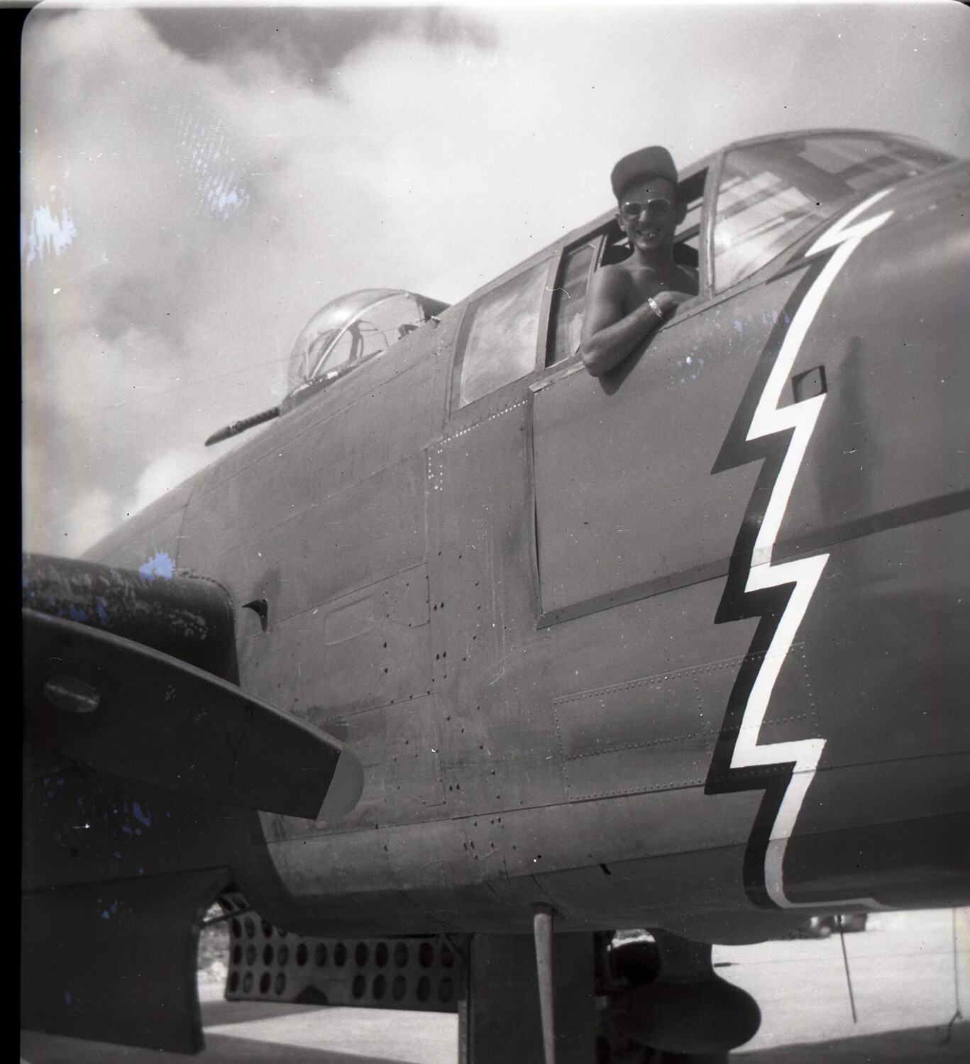 B-25 Mitchell Nose with Lightning Bolt Nose Art and Airman in Cockpit Window, 345th Bombardment Group, Pacific Theater