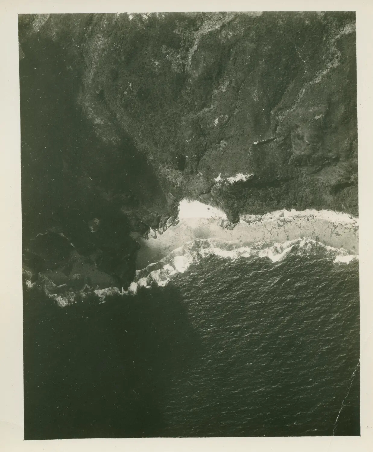 Aerial Reconnaissance Photograph of Pacific Island Coastline, USS Petrof Bay (CVE-80) Collection, WWII