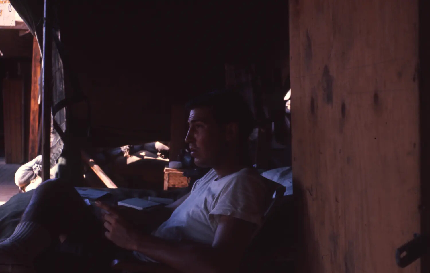 American Serviceman Reading in Barracks Interior, Vietnam War Era (Cam Ranh Bay Album)