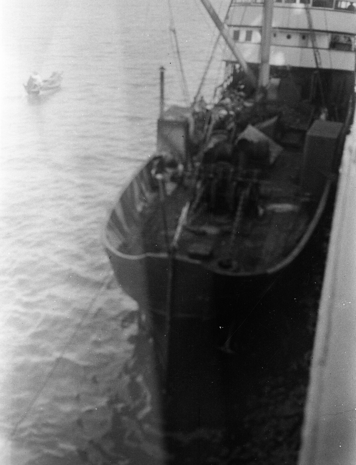 View Looking Down on Ship's Bow with Sampan in Background, China Station, 1930s