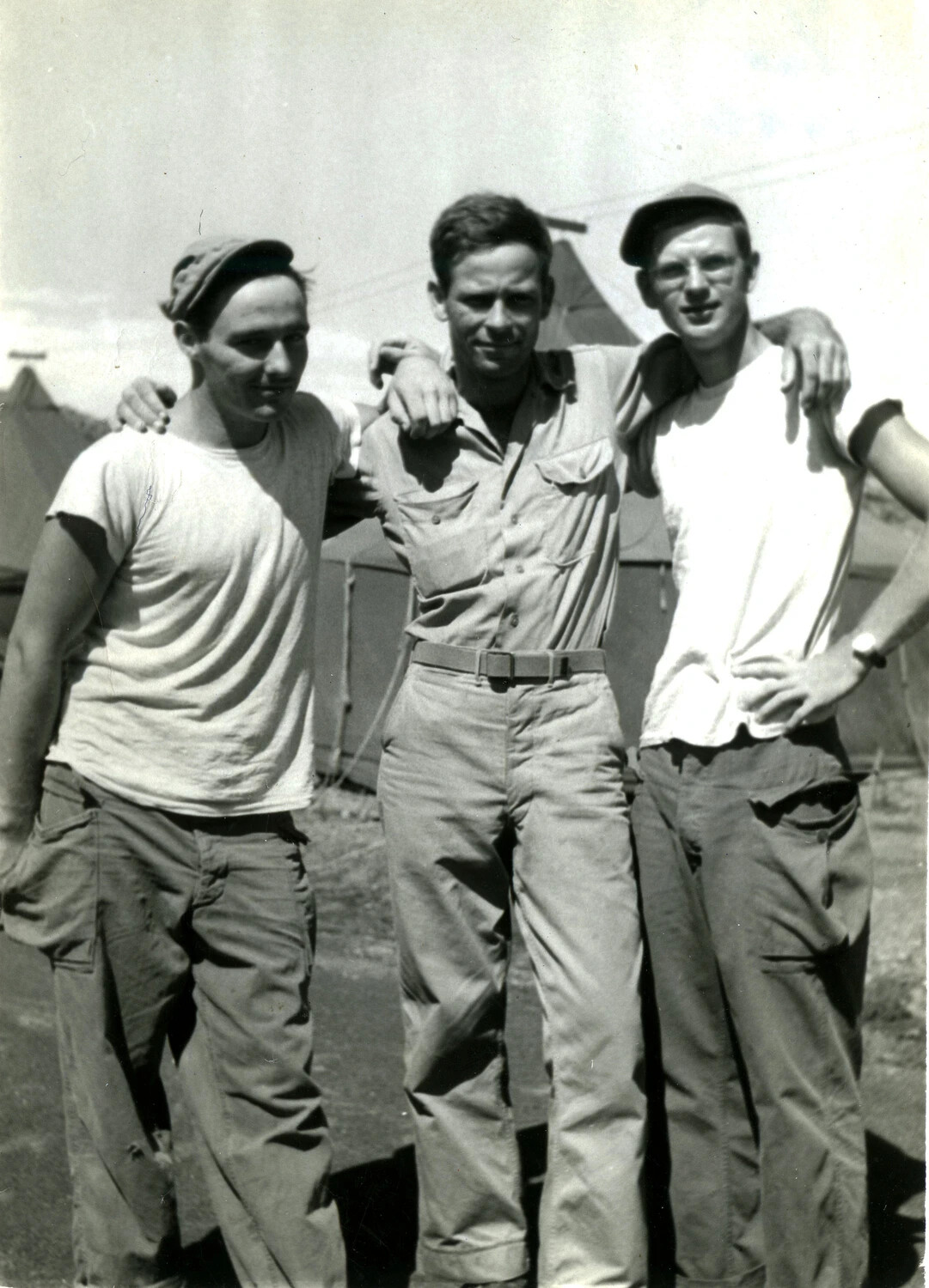 Three U.S. Marines Posing Arm-in-Arm at Camp (Companion Photo), WWII