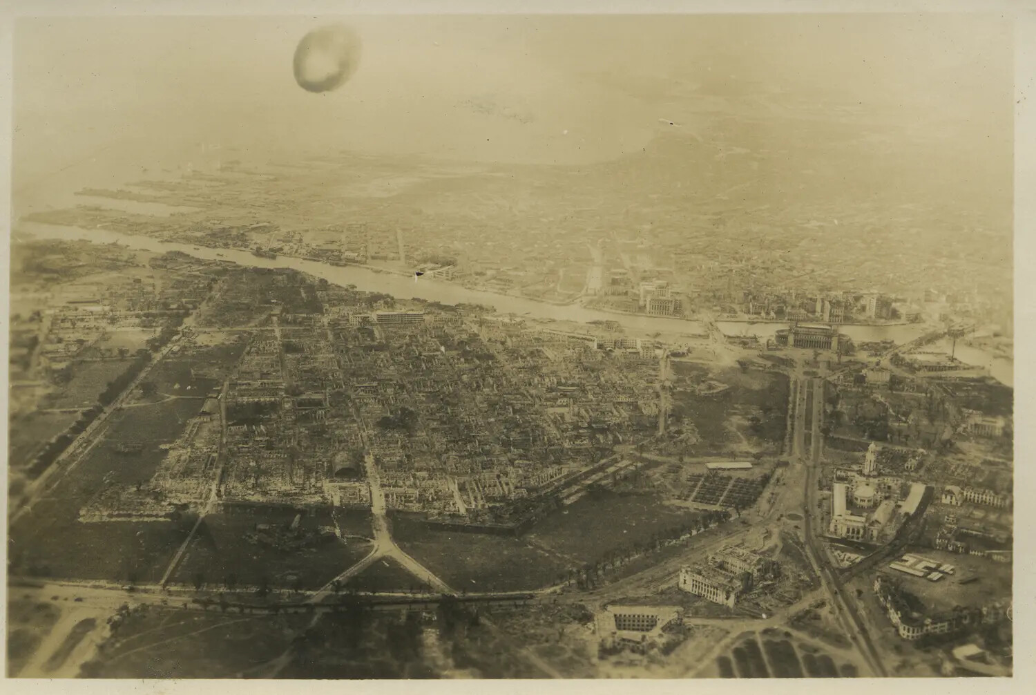 Aerial View of War-Damaged City Along a River, Likely Manila, Philippines, WWII