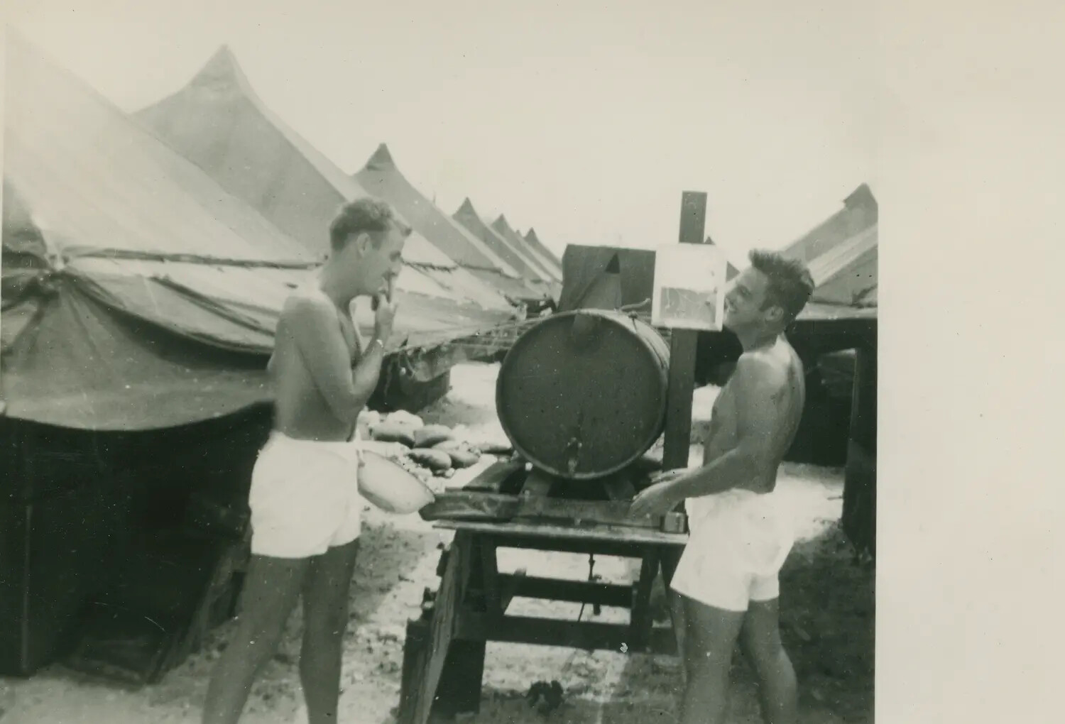 Servicemen at Improvised Outdoor Shaving Station, Pacific Tent Camp, WWII