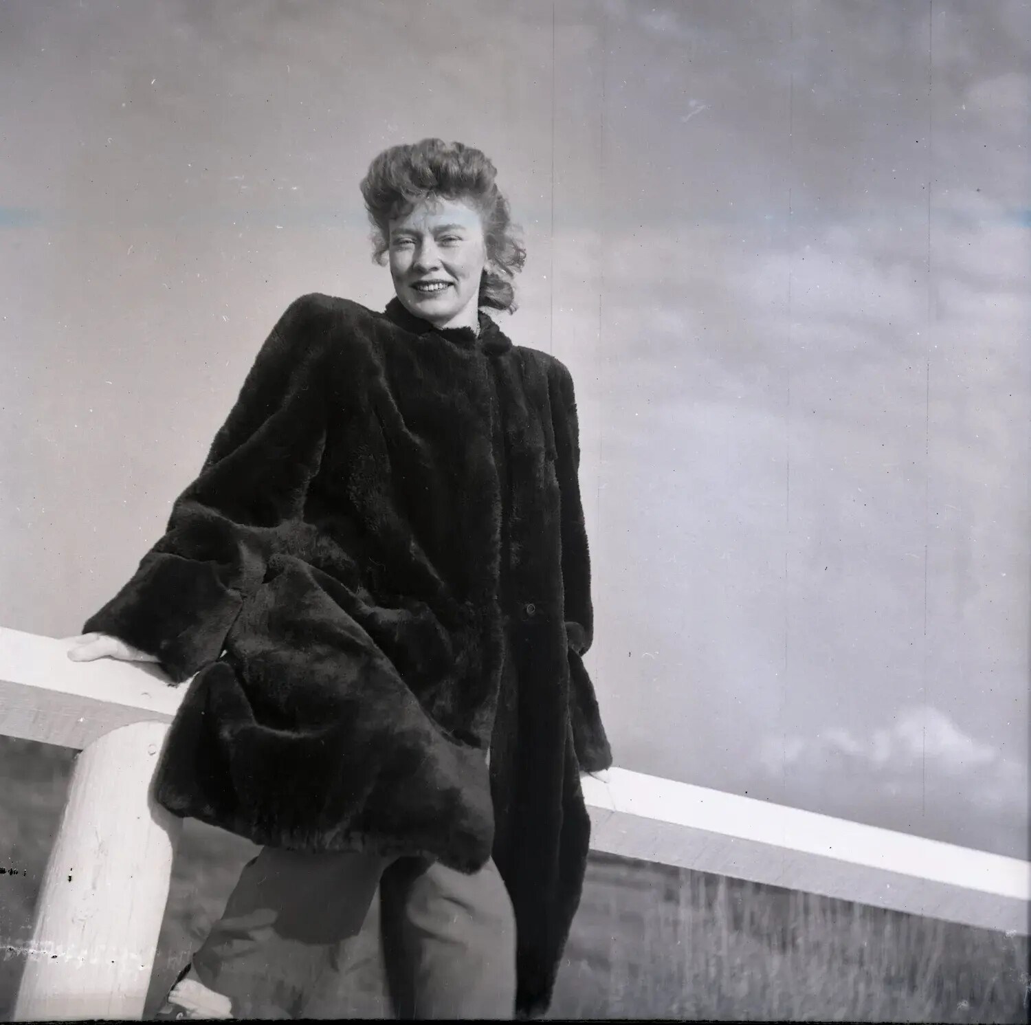 Woman in Fur Coat Leaning on a Railing, Outdoor Portrait