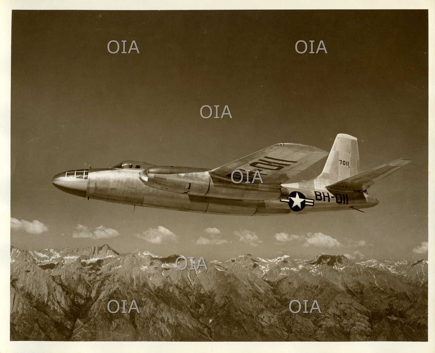 North American B-45 Tornado Jet Bomber in Flight Over Mountain Range