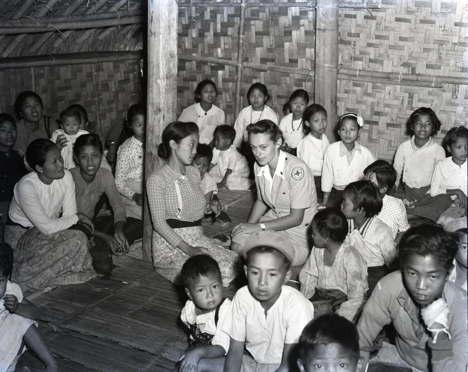 American Red Cross Worker with Karen Women and Children, Burma, World War II