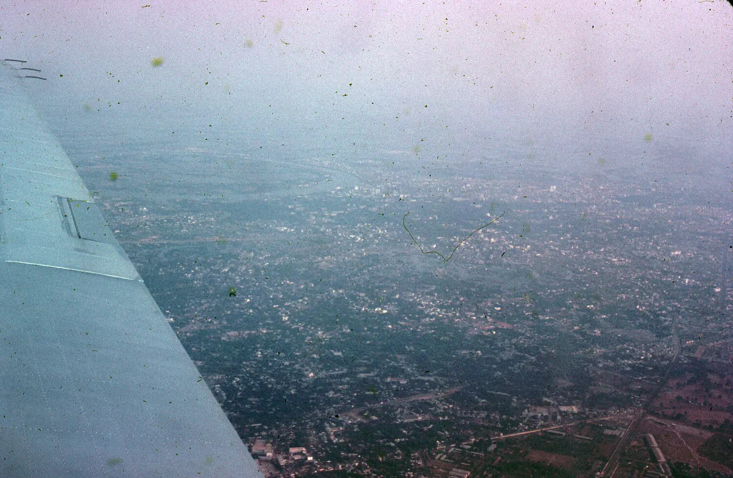 Aerial View of Vietnamese Urban Area from Aircraft Wing, 1965 (3rd Tactical Fighter Wing Collection)
