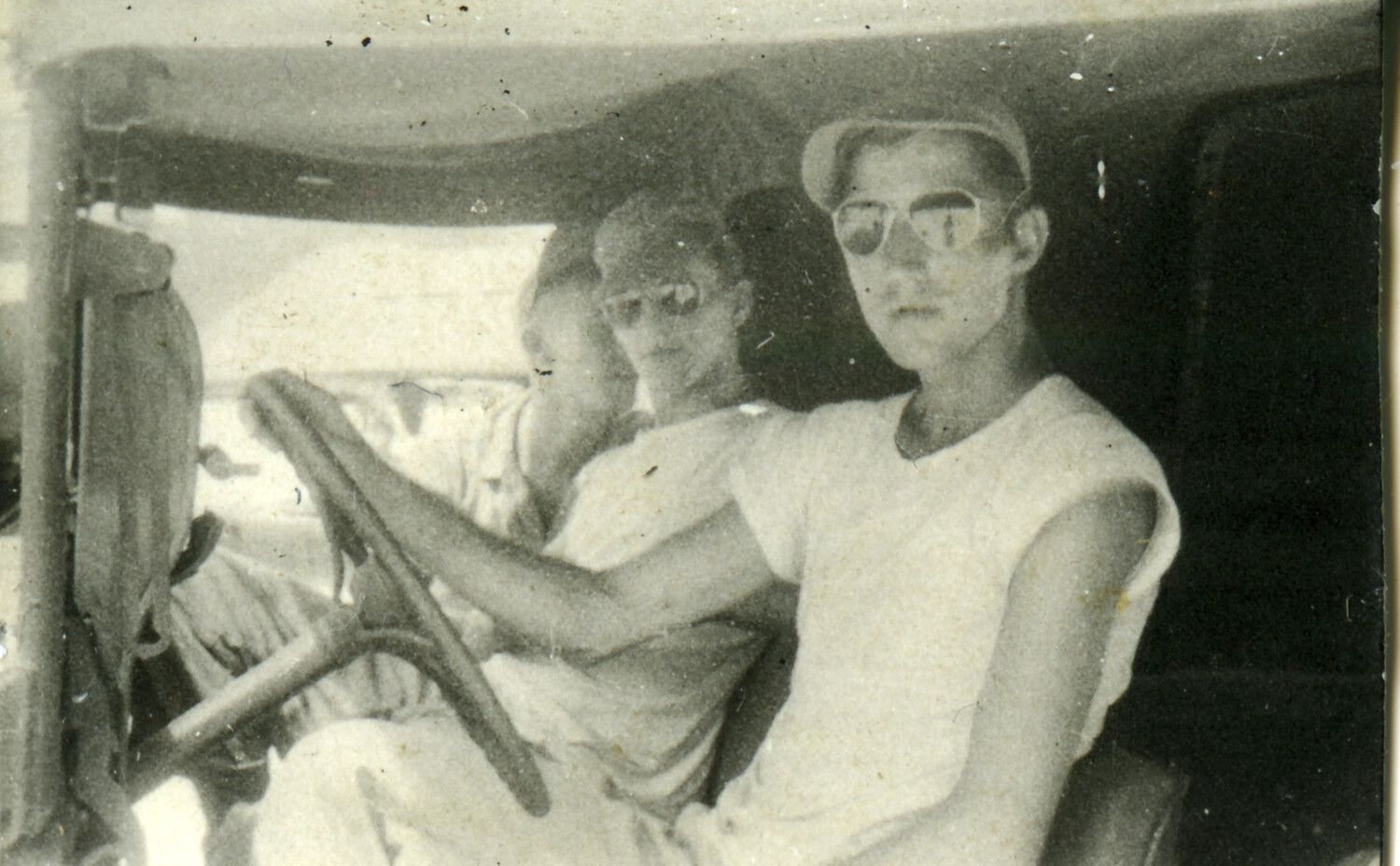 Three Servicemen Posing in a Jeep, Okinawa, WWII Era